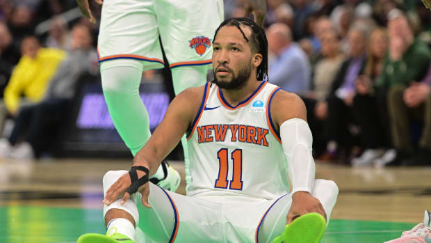 Nov 3, 2023; Milwaukee, Wisconsin, USA; New York Knicks guard Jalen Brunson (11) sits after being fouled in the fourth quarter against the Milwaukee Bucks at Fiserv Forum.